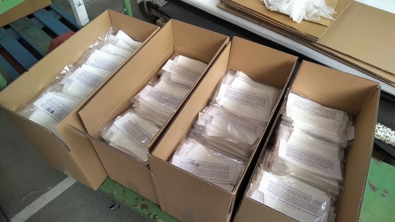 Fig. 7. Ten thousand filter inserts packed in tens ready for distribution. Photo: Archives of the Departments of Chemistry and Physical Electronics, SCI MUNI.