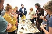 Conference participants in a discussion about medieval pottery from South Bohemia.