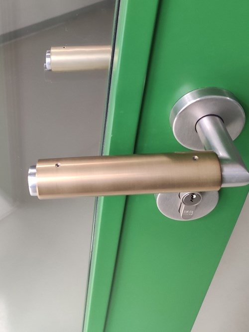 Two coated handles with different amounts of copper admixture have different color tones  