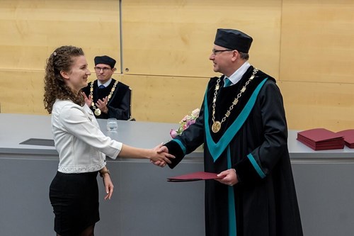 Bc. Kristina Tomanková receives the awards from the Dean Prof. Tomáš Kašparovský